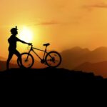 Silhouette Photography of Biker on Top of Hill