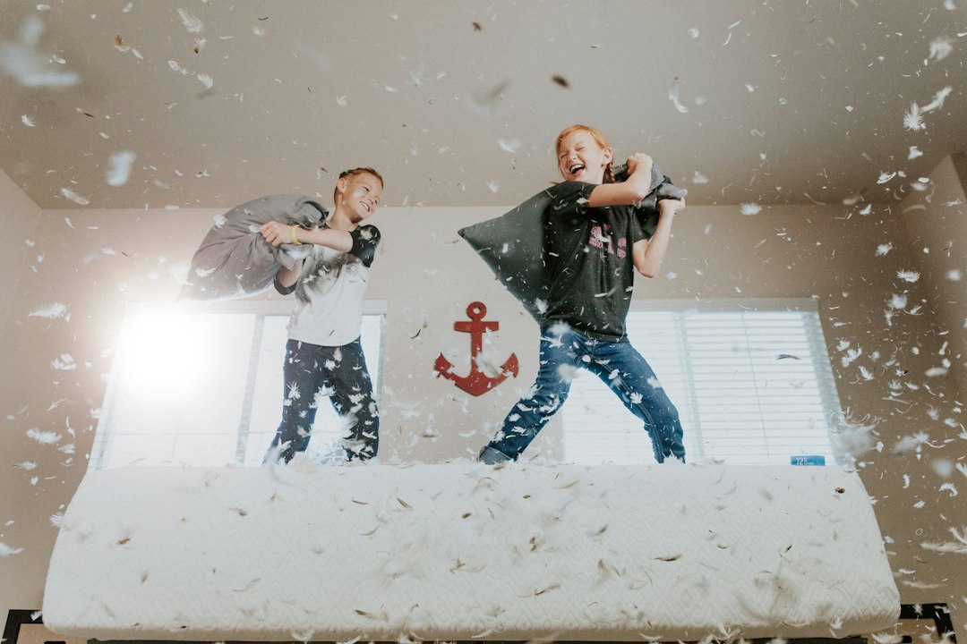 Sunday Morning Pillow Fight by Bike Brands two toddler pillow fighting