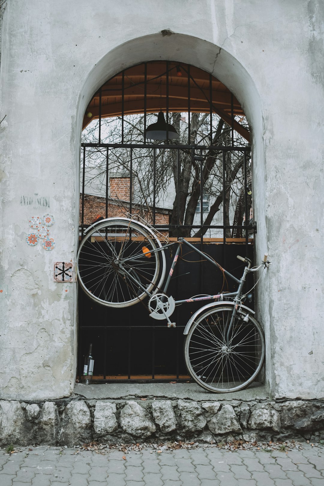 mountain bike near the black house gate