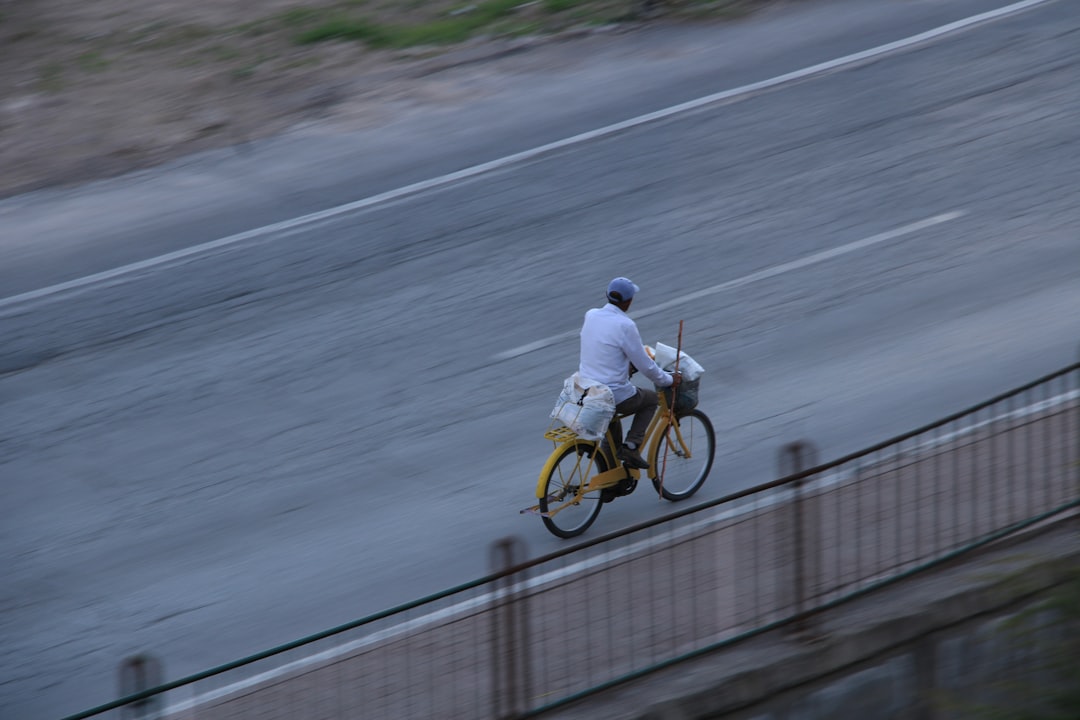 Conclusion: Your Journey with a Belgian Road Bike Starts Here! by Bike Brands a man riding a bike down a street